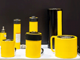 Hollow piston, high tonnage hydraulic cylinders